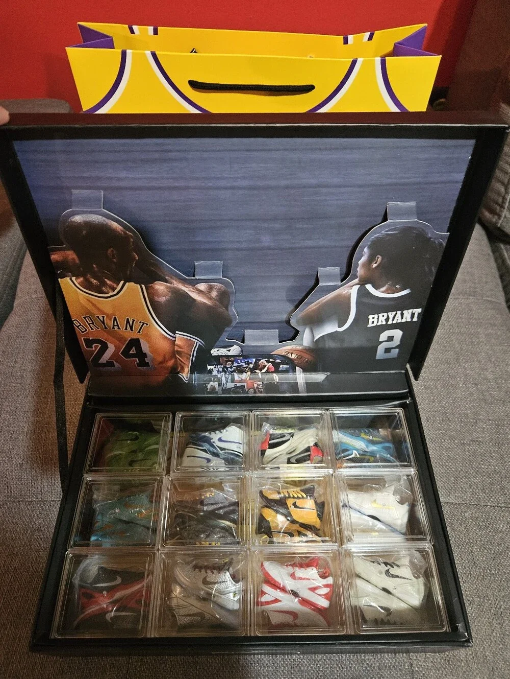 Kobe Black Mamba storage case with 12 mini sneakers included.